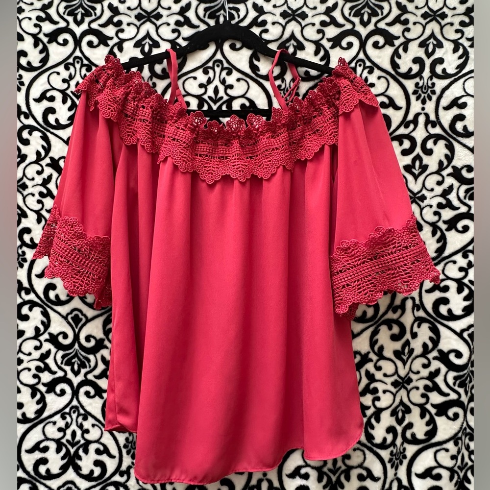 Super cute cold shoulder red blouse.  3/4 sleeves with crochet detail.